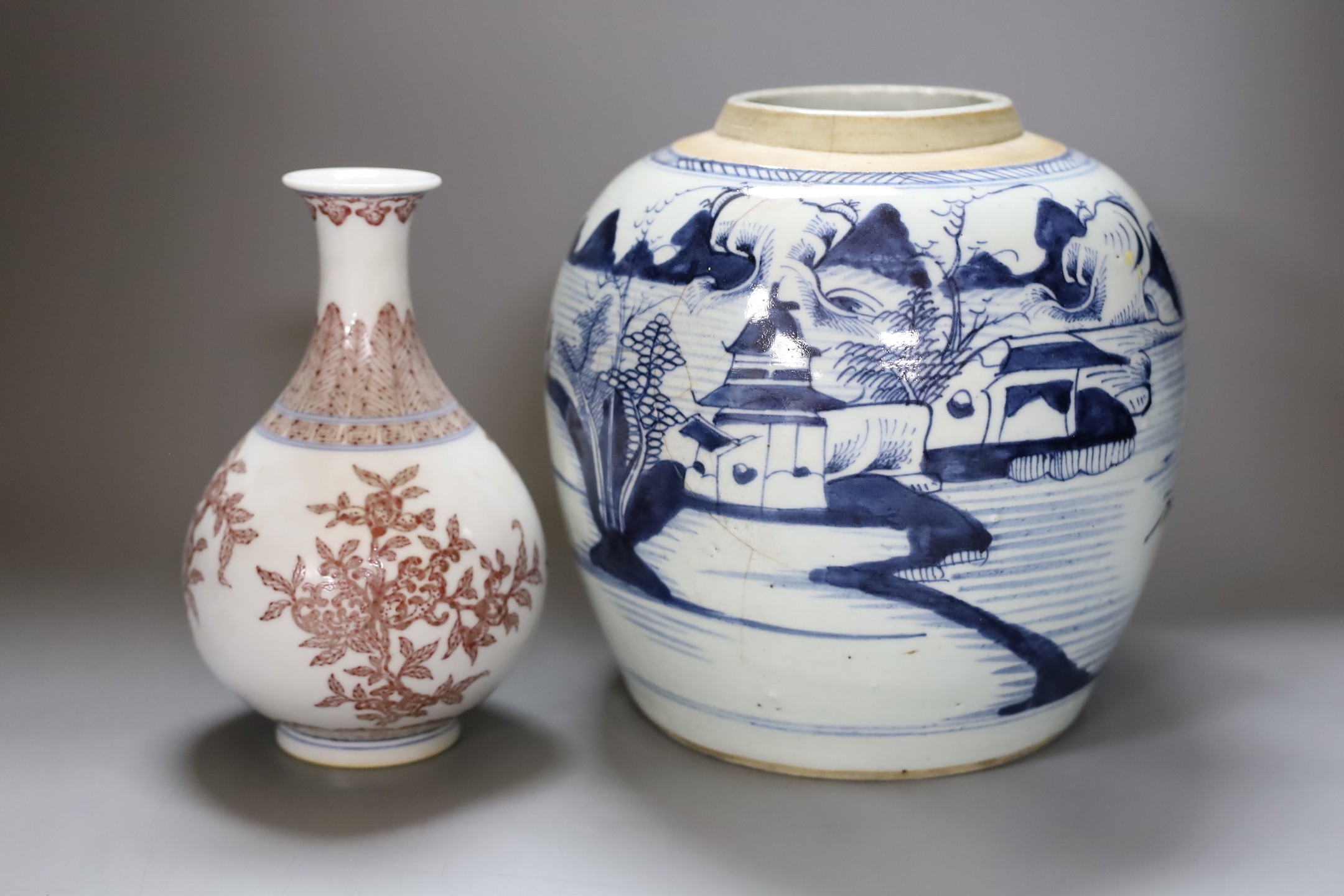 A Chinese Qing blue and white ginger jar with a painted landscape and a blue and copper-red pear shaped vase, tallest 22cm